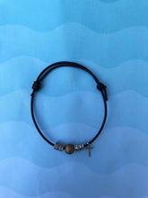 Load image into Gallery viewer, Adjustable Leather Cross Bracelet with Gold and Silver Beads