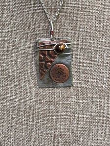 Textured Silver Pendant with Attached Copper Designs and a Wire Wrapped Copper Bead