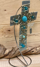 Load image into Gallery viewer, Decorative Hammered Aluminum Display Cross Embellished with Gold Wire and Turquoise Colored Beads. Silver Stand Included