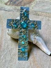 Load image into Gallery viewer, Hammered Aluminum Display Cross Embellished with Gold Wire and Turquoise Colored Beads. Includes a Silver Stand