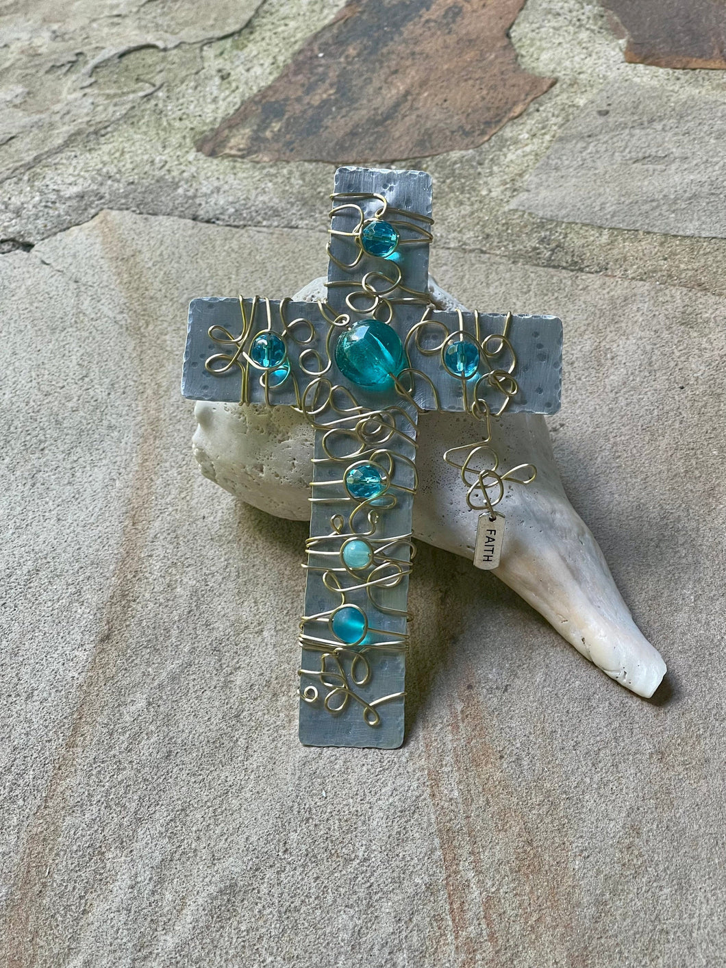 Hammered Aluminum Display Cross Embellished with Gold Wire and Turquoise Colored Beads. Includes a Silver Stand