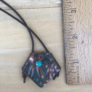 Embossed Copper and Turquoise Bead Pendant Necklace with Leather Cord